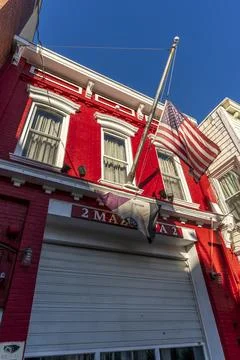 Low-angle view of the vibrant two-story Mazeppa Fire Engine Co. #2 firehouse Stock Photos