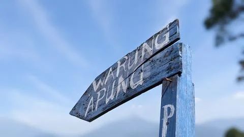 Low angle view of a vintage floating stall directional sign Stock Photos