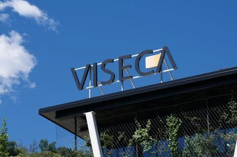 Low angle view of the Viseca corporate sign on a building roof in Switzerland Stock Photos