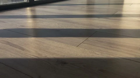 Low angle: view of washing a laminate floor with the flat mop Stock Footage 231504844