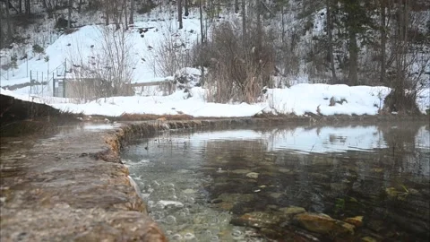 Low angle view of water calmly flowing over small manmade wall Stock Footage 168907513
