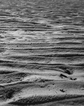 Low angle view of wavy sand at low tide Stock Photos