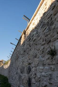 Low angle view of a weathered stone fortification wall Stock Photos