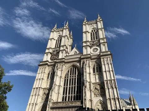 Low angle view of Westminster Abbey twin towers with clock and Gothic stone Stock Photos