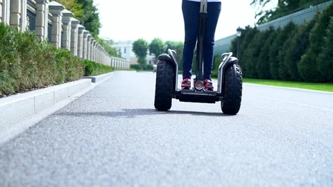 Low angle view of the wheels of a Electric Personal Transporter Stock Footage 95277513