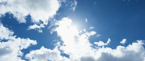 Low angle view of white clouds in the sky on a sunny day Video stock 103406599