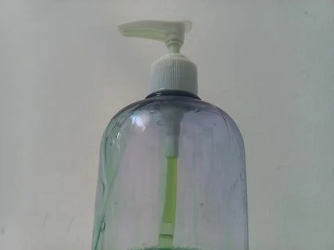 Low Angle View of White Pump Head on Clear Soap Bottle Close Up Stock Photos