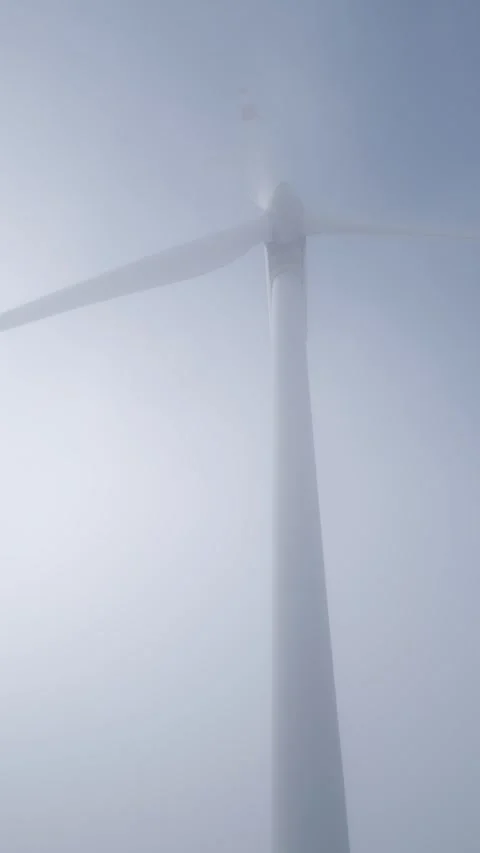 Low Angle View of Wind Turbine in Thick White Fog and Mist Stock-Footage 332711379