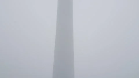 Low Angle View of Wind Turbine in Thick White Fog and Mist Stock Footage 332712428