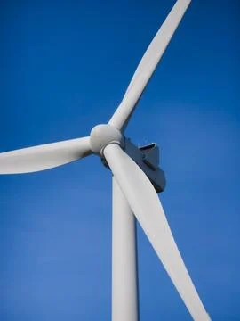 Low angle view of wind turbine against clear blue sky in Belgium, Stock Photos
