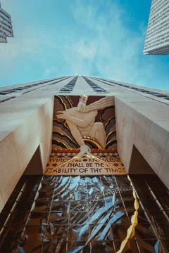 Low angle view of the Wisdom statue, Rockefeller Center, NYC. Stock Photos