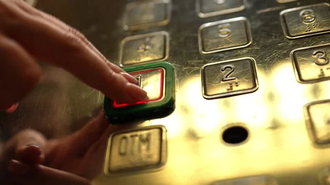 Low-angle view of woman hand pushing first floor button on metallic elevator Stock Footage 342757283