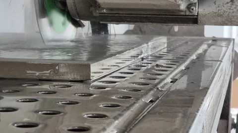 Low Angle View of Worker Cutting Raised Floor Panel with Wet Saw Vídeos de archivo 332874610