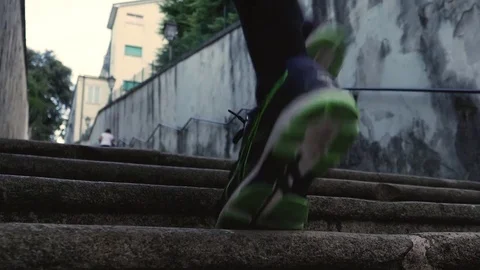 Low angle view of young man running up the stairs. Stock Footage 80925621