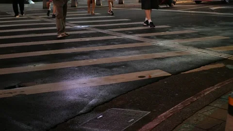 Low angle view to the at zebra crossing area at intersection while people p.. 動画素材 259605880