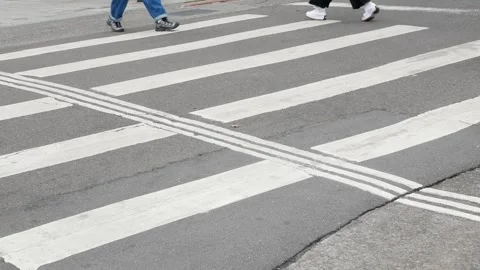 Low angle view to the at zebra crossing area at intersection while people p.. Stock Footage 259606162