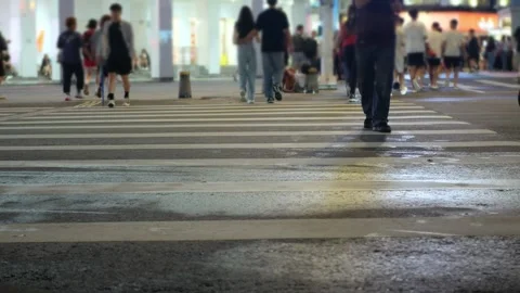 Low angle view to the at zebra crossing area at intersection while people p.. 動画素材 273271180