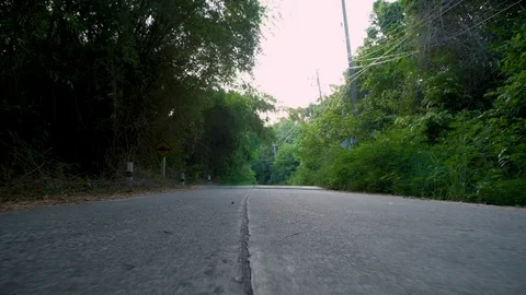 Low Angle Walking on Rural Road in Tropical Southeast Asian Jungle Stock Footage 119693820