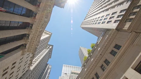Low angle Wall Street architecture New York Stock Exchange building exterior sun Video stock 122304719