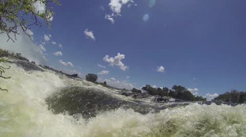 Low angle of water rushing along Zambezi River Видео 22870007