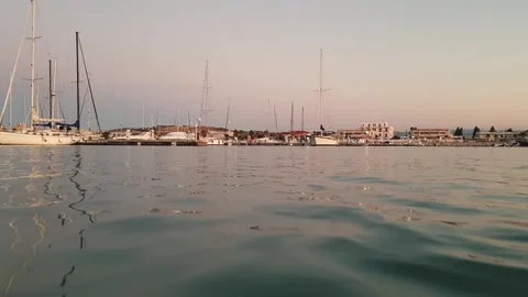 Low angle water surface pov of boat returning to port Stock Footage 279904416