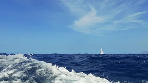 Low angle water surface view of sailing boat from another vessel Stock Footage 279890587