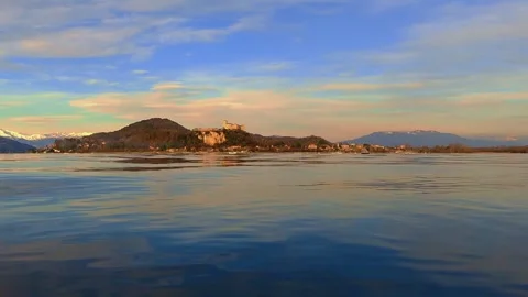 Low-angle water view of maggiore lake with castle in background Stock Footage 279867255