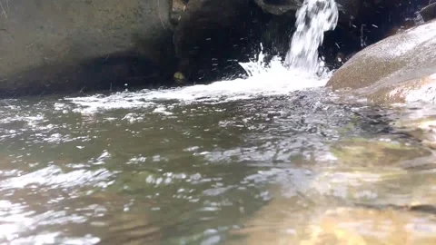 Low Angle Waterfall Splashing Into Clear Mountain Pool 4K Nature Stock-Footage 341836148