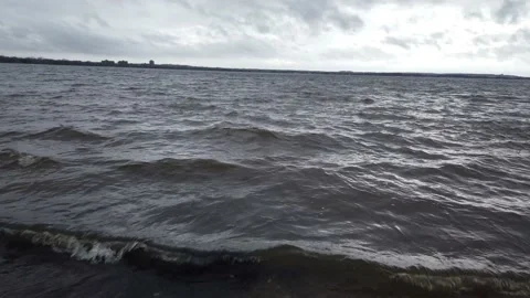 Low angle waves on a river Stock Footage 143197048