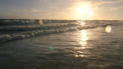 Low Angle Waves on Shore at Sunset Stock Footage 96293956