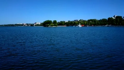 Low angle while boating around Ternopil Pond on sunny day. Stock Footage 70950165