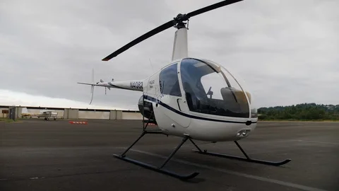 Low angle wide of a Helicopter Sitting on the Tarmac Stock Footage 114416763