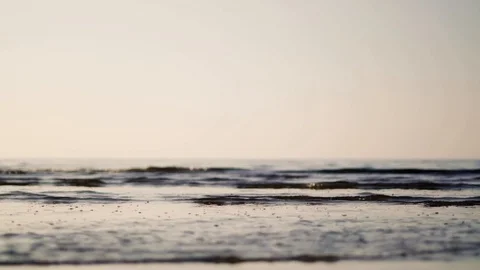 Low angle wide shot over grey waves with tiny bubbles 스톡 동영상 110753452