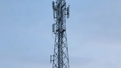 Low Angle Wide Tilt-Up Shot of Telecommunications Cell Tower Stock Footage 346821306