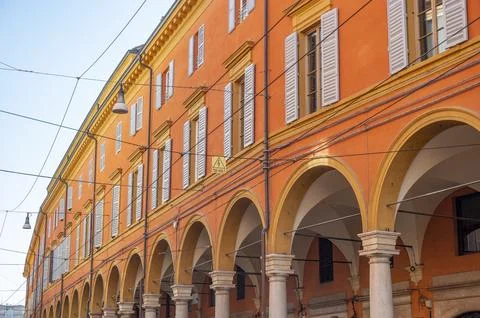 Low Angle wide View Of orange Historical Building in Modena with arcs, Emilia Stock Photos