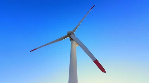 Low angle of wind turbine blades against clear sky Video stock 341762118