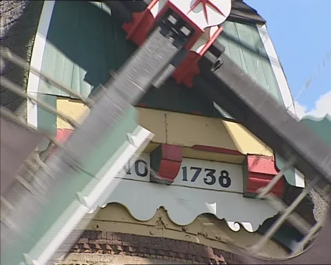 Low angle - windmill operating - close up roof cap plate anno 1738 Stock Footage 141597039