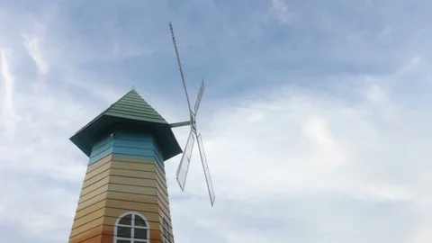 Low angle of wood windmill, clouds, blue sky time lapse Stock Footage 93639461