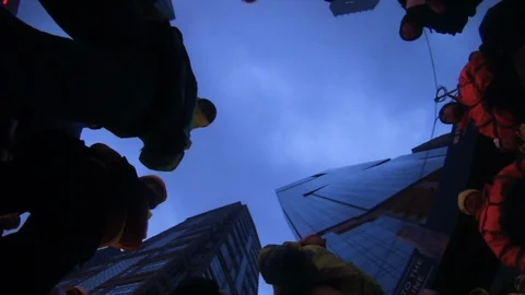 Low angle of workmen talking Stock Footage