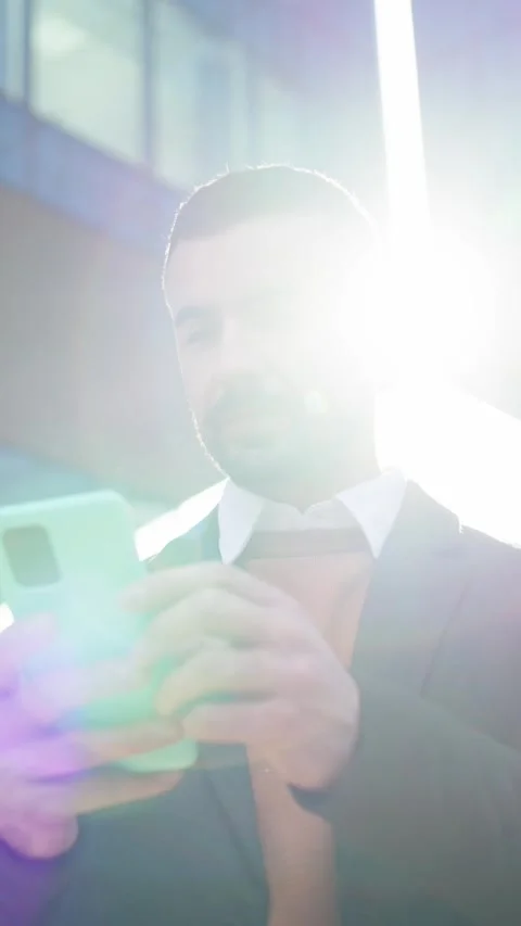 Low angle. Young Caucasian formal man standing in front office building looking Stock Footage 315880706