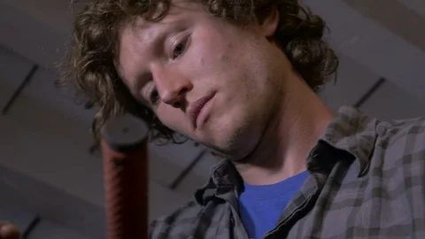 Low angle of a young millennial man working with an allen wrench Stock Footage 69907696