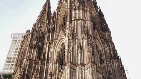 Low-angle zoom of Cologne Cathedral tower and scaffolding Stock Footage 320193625