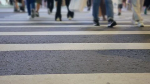 Low anngle view while crossing the street at zebra crossing  in downtown Ta.. Stock Footage 281833448
