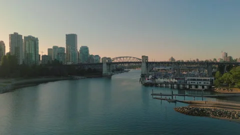 A low approach to False Creek and the Burrard Street Bridge in Vancouver Stock Footage 315701236