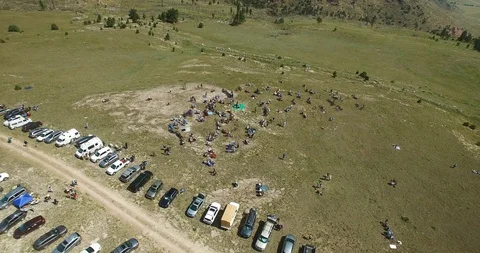 Low Backwards Flying Aerial View Of The People Gathering To Watch The Stock Footage 99114428