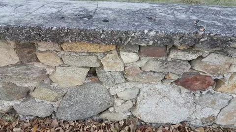 Low boundary wall built from stone Vídeos de archivo 97206915