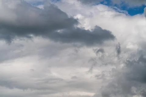 Low brooding overcast filling horizon, dense gray masses with muted light a.. Foto stock
