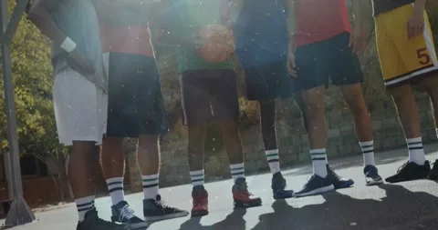 Low camera rising, six players posing on court for portrait while sun flare Stock Footage 333962920