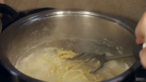 Low carb spaghetti pasta boiled and done Stock Footage 156028201