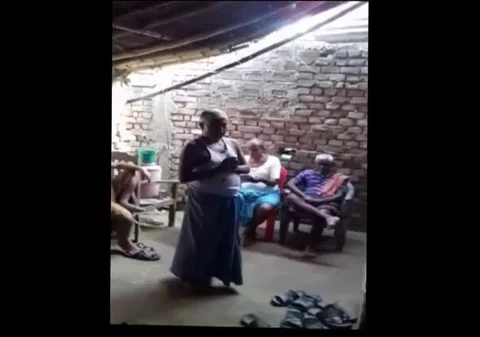 Low caste,man forced to lick own saliva from ground Stock Footage 109262472